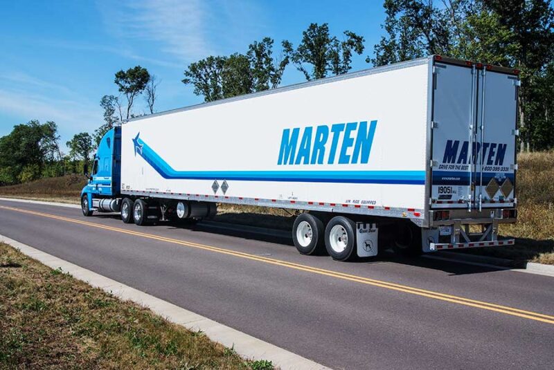 Blue Marten truck on two lane road