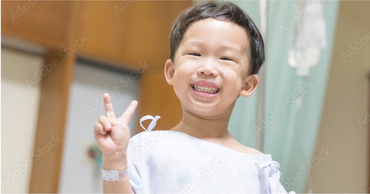 Little boy giving peace sign and smiling about Marten's community commitment.